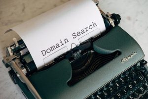 Typewriter with a paper that says "Domain Search"