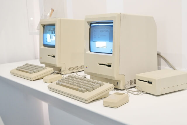 Two retro Apple Macintosh computers