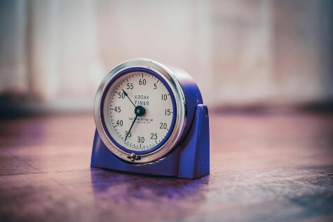 Vintage, blue timer sitting on a table