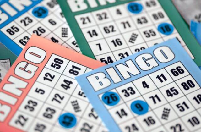 Blue, green, and red Bingo Cards overlapping